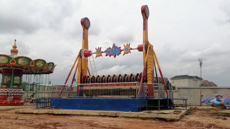 Installation of top spin ride in the Dream world park